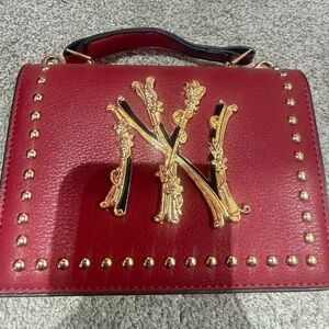 Elegant Red Handbag with Gold Accents